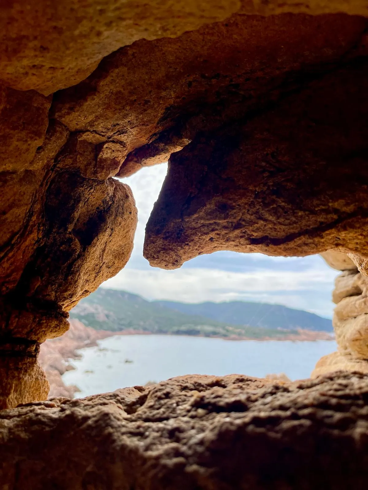 A natural rock window over the bay